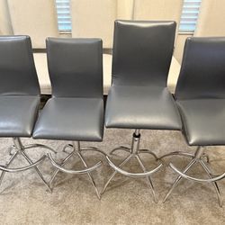 Four Grey Swivel Bar Stools
