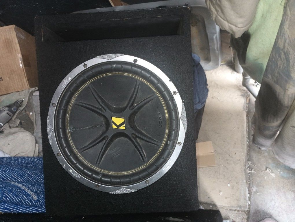 12-in Kicker Comp. Subwoofer With a Ground Shaker Box.