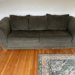 Green sleeper sofa (pull-out couch) + IKEA mattress topper