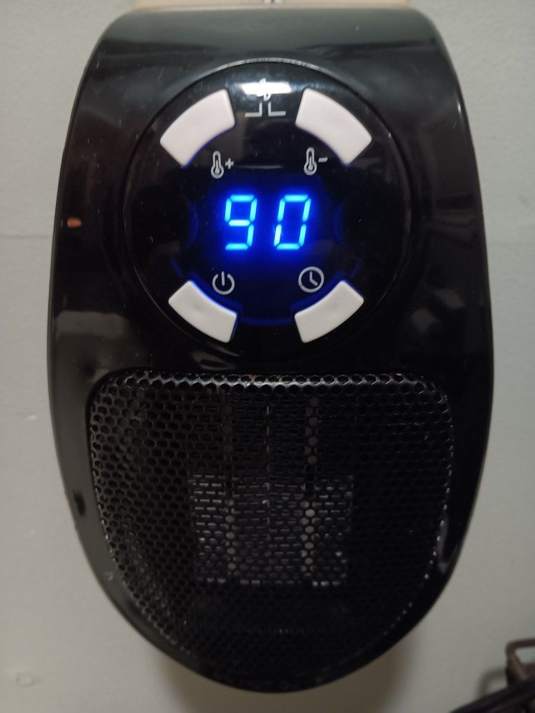 Mini Electric Heater W/fan. Walloutlet