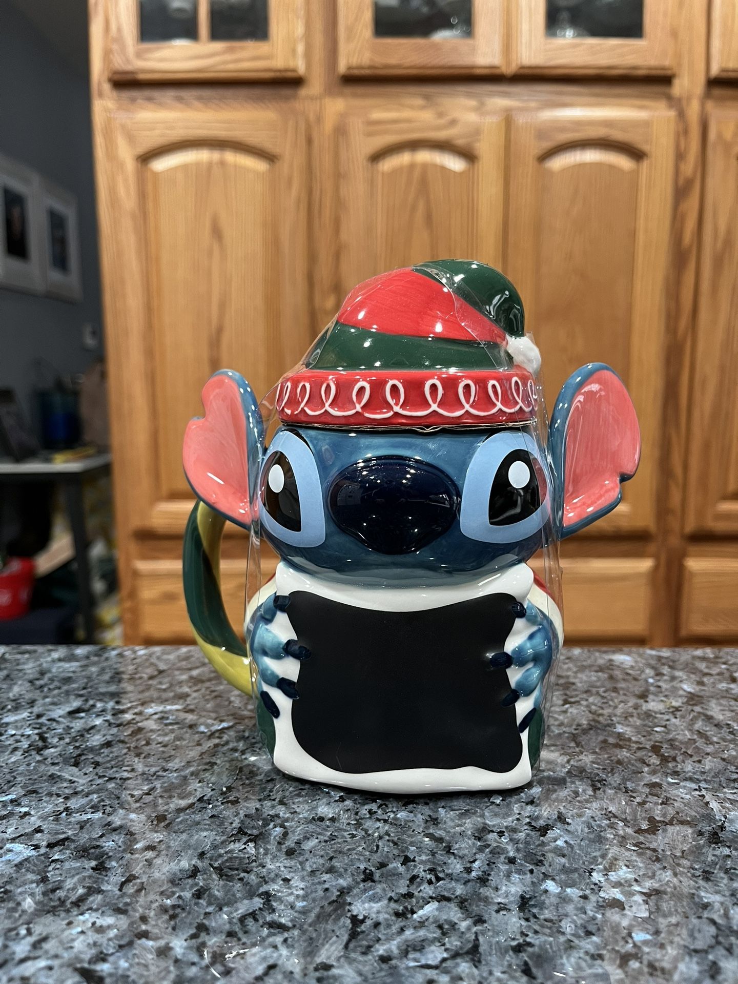 Disney Stitch Festive Mug with Lid, Lilo & Stitch. There are no white spots on the mug the lightening is bad in the picture. Brand new with tags. S