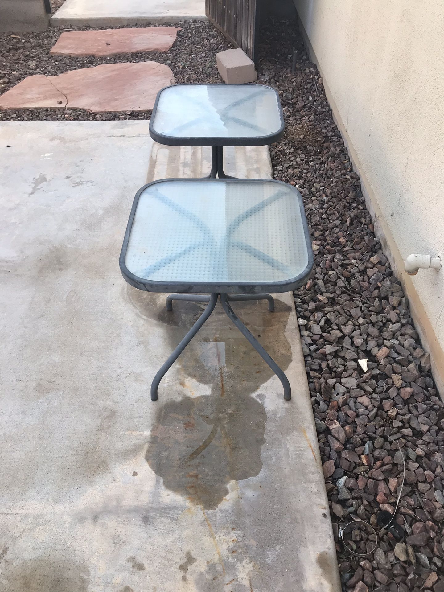 2 - 16” glass top pool lounge chair side tables. Metal base. Selling as set.