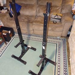 Adjustable barbell stands