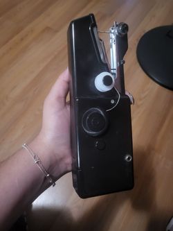 Handheld sewing machine