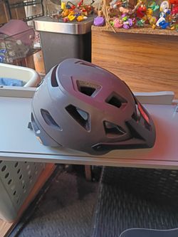 Adult Ozark Trail mountain bike safety Helmet; comes with a 9 mode LED light.
