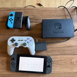 Nintendo Switch With SD Card Cables And Controllers