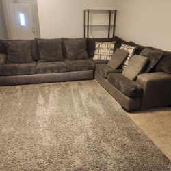 Grey Sectional With Pillows.