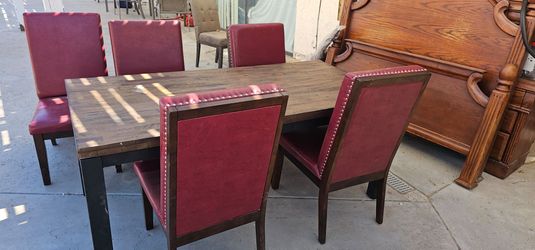 Red leather chairs and dinner table