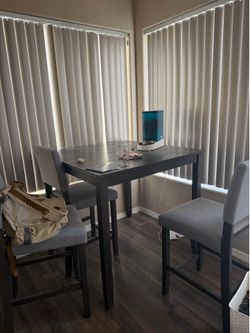 Square wood dinner table with 4 chairs