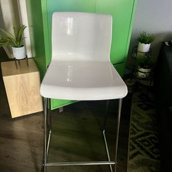 IKEA bar stool in white with chrome-plated legs.  