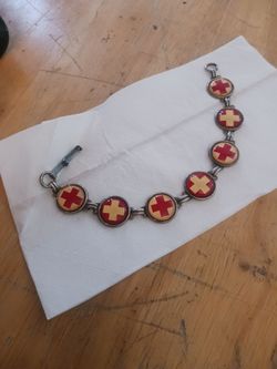 Vintage red cross charm bracelet World War II era.
