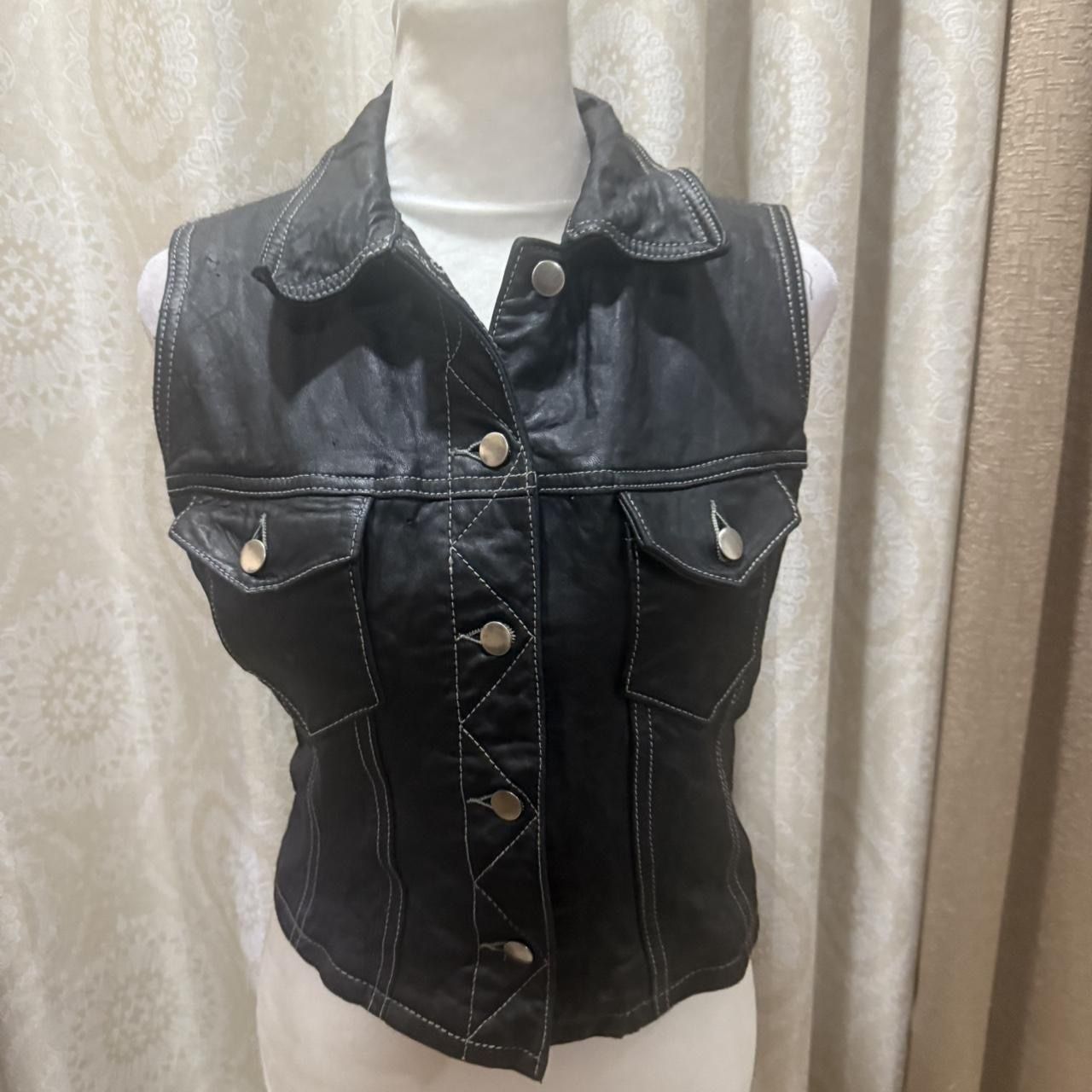 Black leather vest with silver hardware