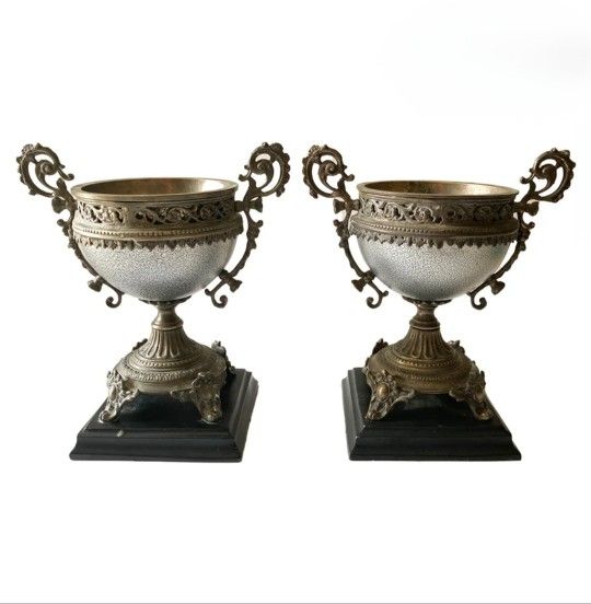 Castilian Imports Pair of Silver Metal Urns on Black Bases