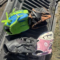 Child, baseball gloves, and baseball/softball helmets and baseball/softball