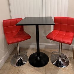 Bar table set with 2 red stools – good condition