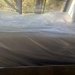 Full Queen size bed with bed frame and drawer below the bed