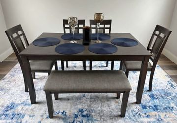 Beautiful Crown Mark dining table. 4 chair and bench in excellent condition.