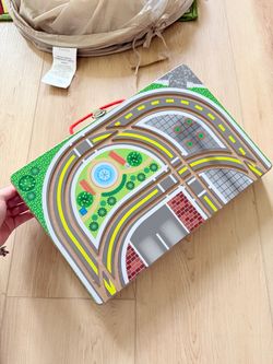Melissa and Doug take and go town