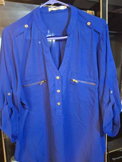 Beautiful dressy blue short sleeve blouse .