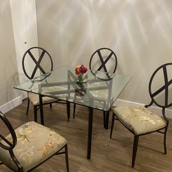 Glass Top Dining Table With Safari Printed Seats 