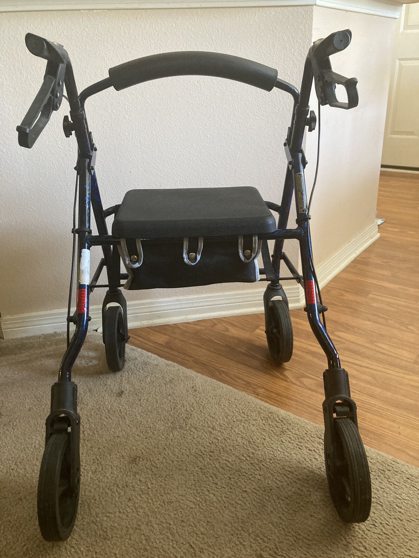 Four Wheeled Walker With Seat