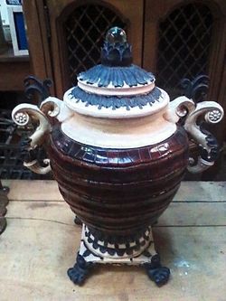 Urn 15 inches tall by 11 inches wide