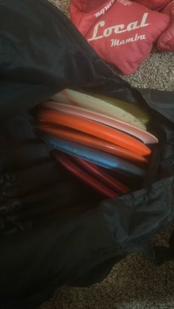 By full of disc golf frisbees