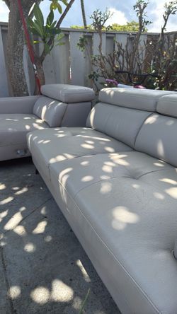 Small sectional couch with adjustable headrest 