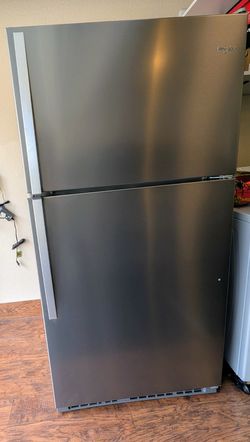 Whirlpool top freezer refrigerator model WRT311FZDZ02