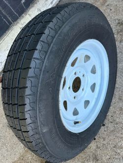 Like New 15 Inch Trailer Wheel And Tire 