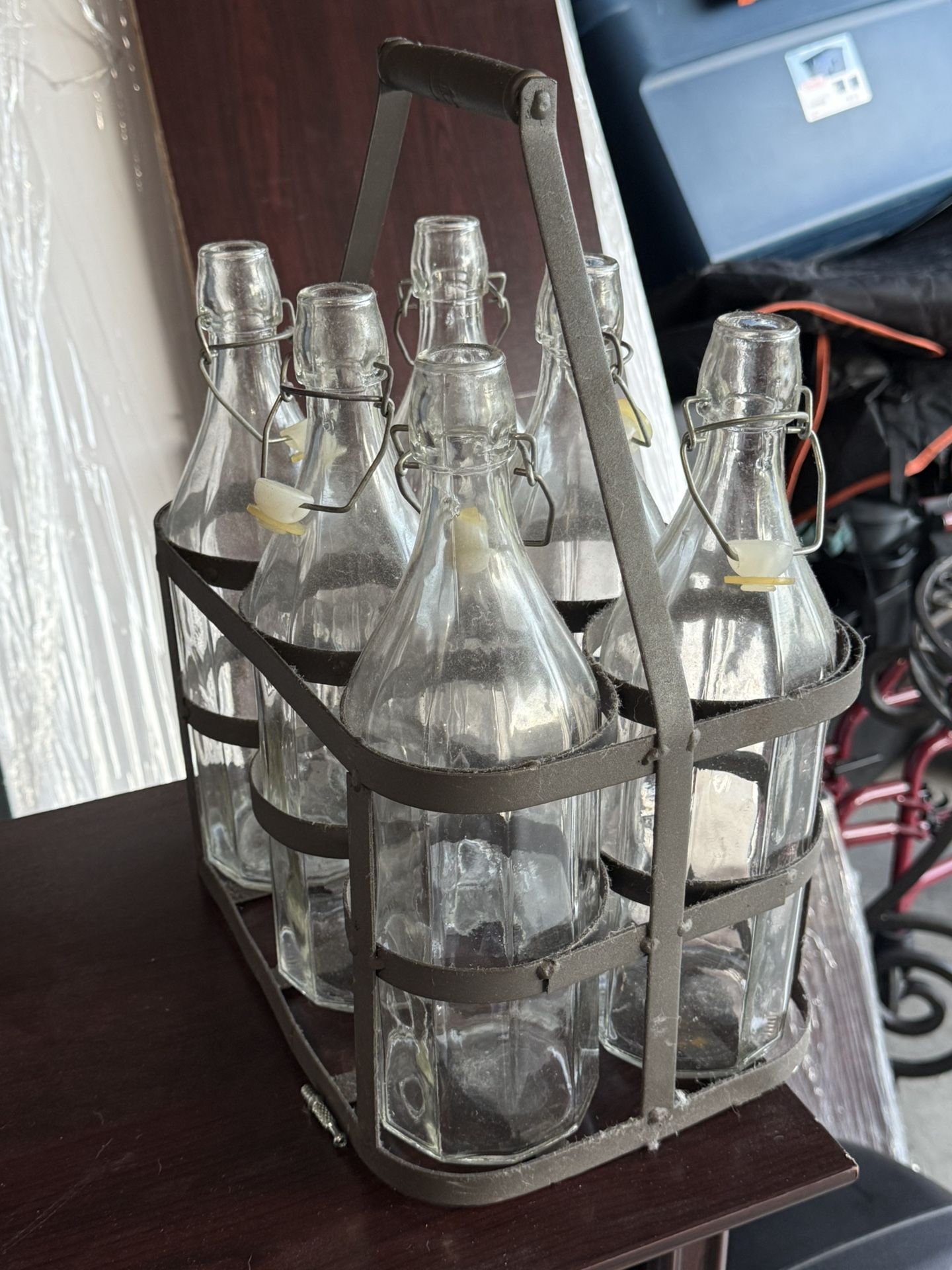 6 Vintage Glass Bottles With Lids In Metal Carrying Rack