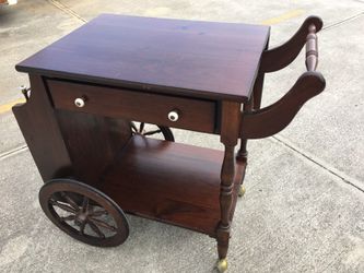 Vintage mid century rolling leaf tea serving cart . Brown wooden in great shape.