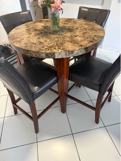 Round marble table with 4 chairs