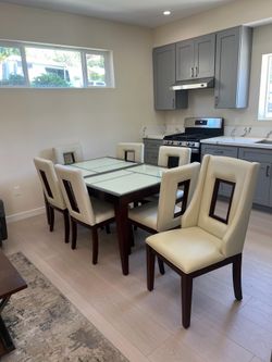 Sectional couch, coffee table, dining table with eight chairs