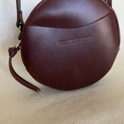 PORTLAND LEATHER GOODS BROWN ROUND CROSSBODY BAG