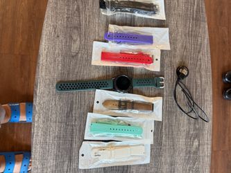 Samsung Galaxy Watch 6 bundle with a charger and six extra watch bands