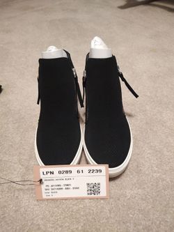 Black tennis shoes with side zippers