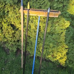 Half Moon edger, two broom handles, and a push broom