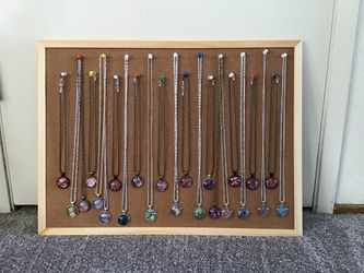 Pendant style necklaces with many different design cabochones . Each one is unique