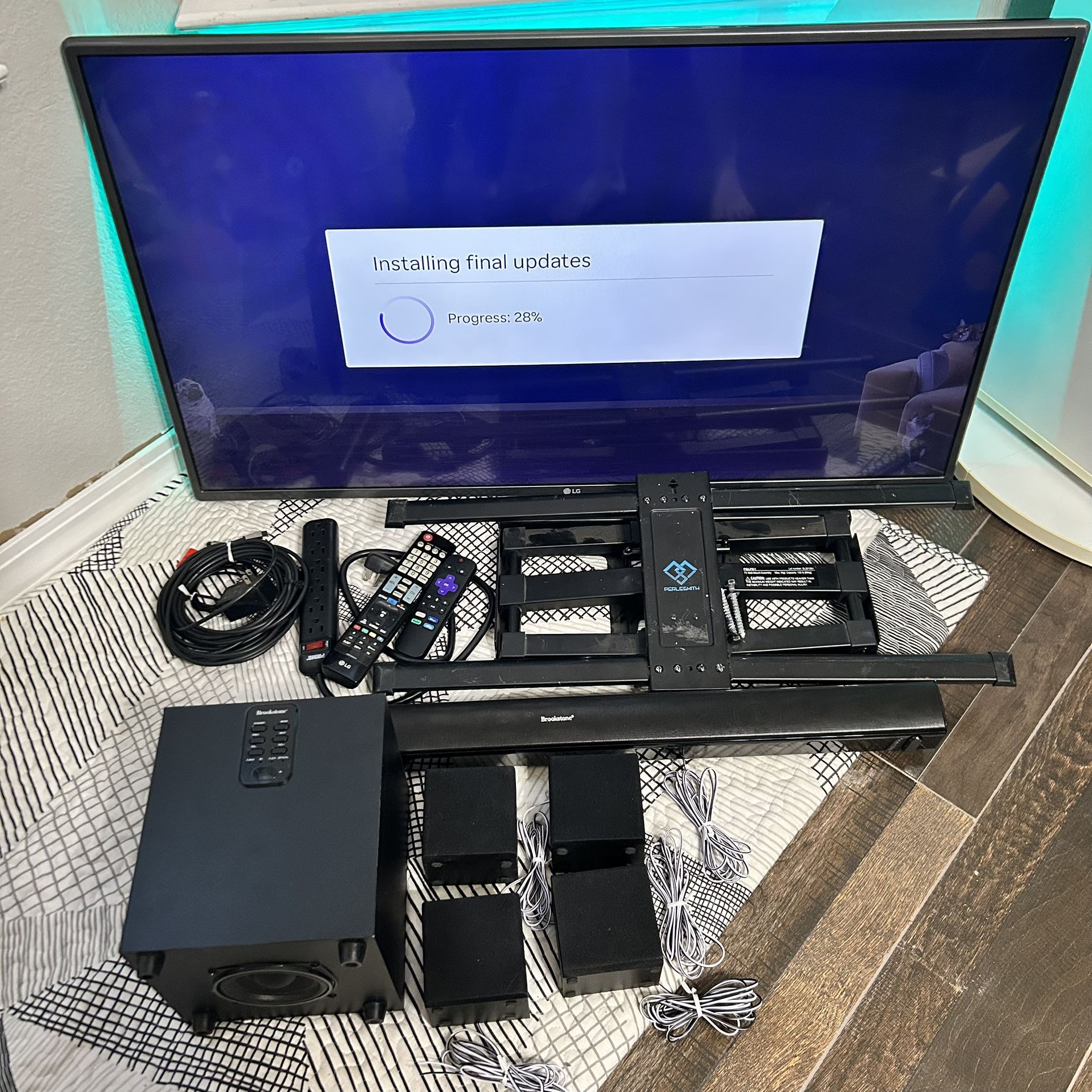 LG 42” TV With Wall Mount, Roku, & Brookstone Surround Sound System