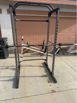 Very nice and strong squat rack with 7 ft Olympic bar. Perfect for squats, bench press, and pull ups. $300