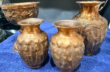 Persian copper vases featuring embossed scenes of soldiers/ancient figures