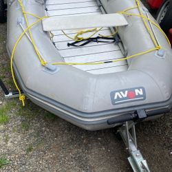 Blowup boat with hard bottom, electric motor or gas motor and trailer