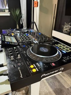 Pioneer DJ XDJ-XZ all-in-one DJ system. It is a professional DJ controller that combines: 2 large jog wheels for scratching, cueing, and beat matching