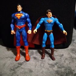 Two Superman Figurines