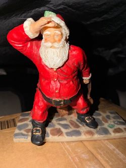 Santa Claus Figurine on Cobblestone Base