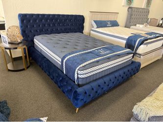 Queen bed frame in blue velvet