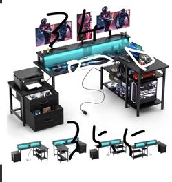 Double-sided L-shaped computer desk gaming desk with power sockets and LED light strip, storage rack, black