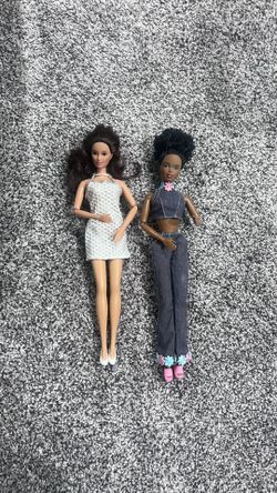 Two Barbies With Flexible Arms