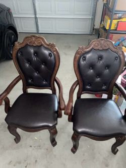 2 dining height leather chairs (very elegant)